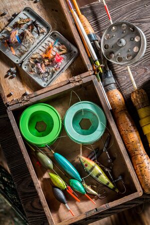 Old fishing tackle with floats, hooks and rodsの写真素材