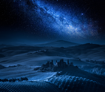 Farm of olive groves, vineyards and milky way, Tuscanyの写真素材