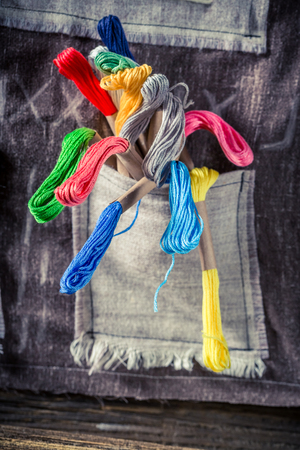 Closeup of colored threads in tailor workshop