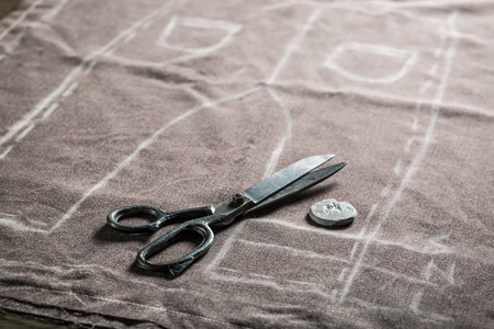 Vintage tailor pattern of trousers with scissors and clothの写真素材