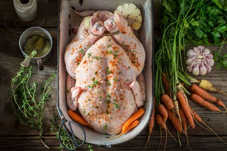 Ingredients for roasted chicken with vegetables and herbsの写真素材
