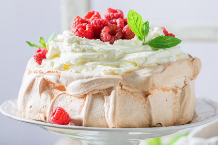 Sweet Pavlova dessert made of mascarpone and berriesの写真素材