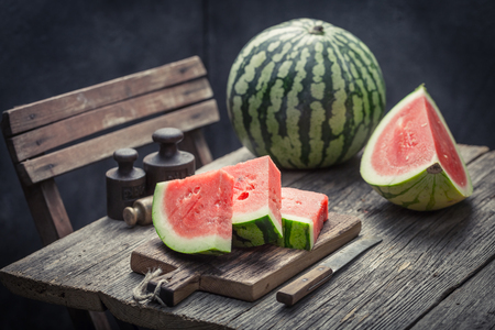 Sweet and tasty watermelon on an old wooden tableの写真素材