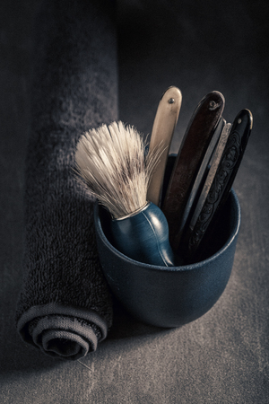 Vintage barber equipment with grey soap, razor and brushの写真素材