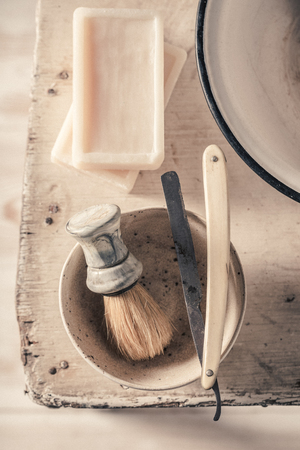 Old shaving set with foam, razor and brushの写真素材