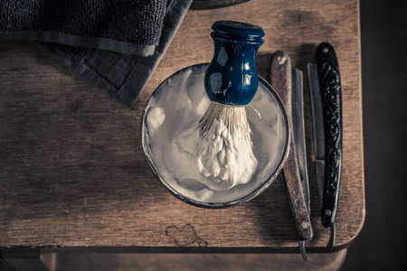 Vintage tools for barber with grey soap, razor and brushの写真素材