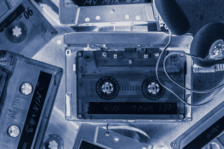 Retro cassette tape with headphones and mp3