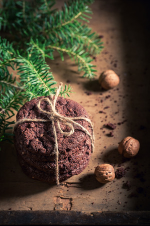 Brown chocolate cookies on old rustic tableの写真素材