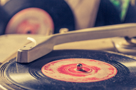 Classic record player and old vinyls with scratchedの写真素材