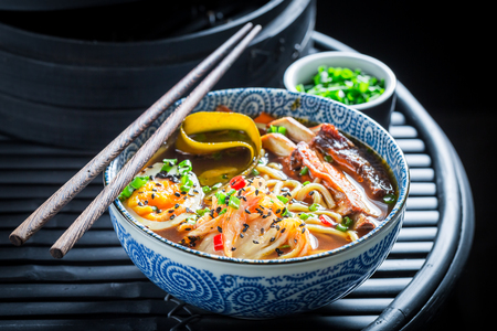 Closeup of Kimchi soup with ribs and eggsの写真素材