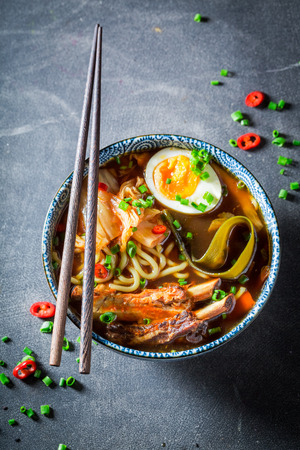 Closeup of tasty Kimchi soup with chive and noodlesの写真素材