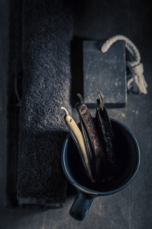 Unique barber equipment with foam, old razor and brushの写真素材
