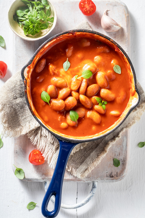 Enjoy your baked beans made of fresh tomatoes and herbsの写真素材