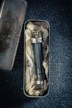 Unique syringes with a needle in a stainless steel containerの写真素材