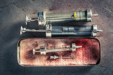 Unique needle and syringes in a stainless steel containerの写真素材