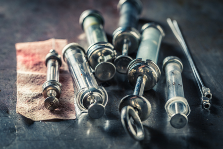 Classic needle and syringes prepared for blood testの写真素材