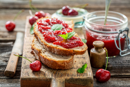 Tasty sandwich with jam made of cherriesの写真素材