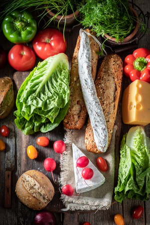 Delicious preparation for sandwich with cheese, tomato and radishの写真素材