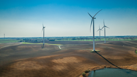 Aerial view of wind turbines in sunny dayの写真素材