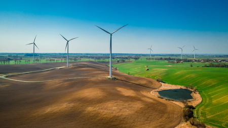 White wind turbines as pure energy, aerial viewの写真素材