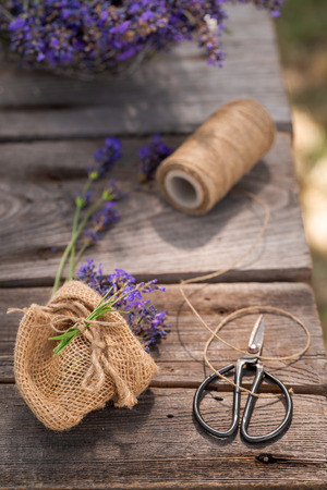 Freshly harvested lavender on wooden table in summerの写真素材