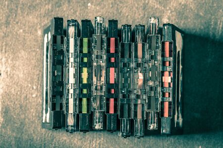 Old pile of cassette tape on gre tableの写真素材
