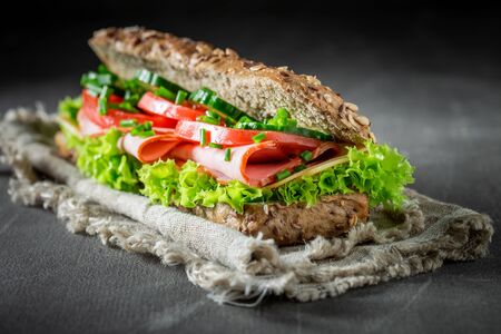 Fresh sandwich with ham, chive and cheese for breakfastの写真素材