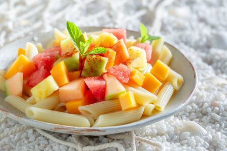 Sweet penne with mix of exotic fruitsの写真素材