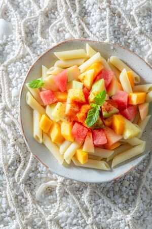 Sweet penne with papaya, melon and pineappleの写真素材