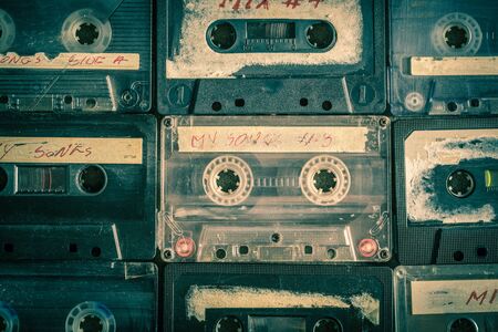 Top view of old cassette tape placed in gridの写真素材