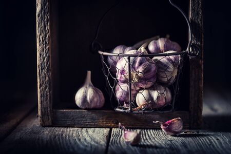 Homegrown garlic in old rustic wooden boxの写真素材
