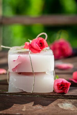 Handmade and aromatic rose soap wrapped in a stringの写真素材