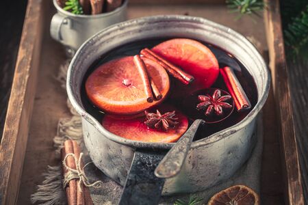 Homemade mulled red wine with spruce and spicesの写真素材