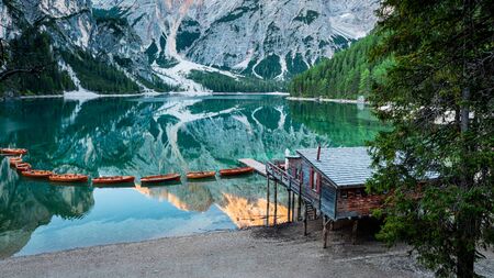 Stunning wooden hut and Lago di Braies in Dolomites, Italy