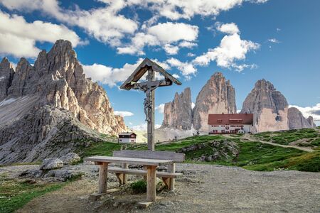 Little Christian cross, Tre Cime and Dreizinnen hut, Dolomites, Italyの写真素材
