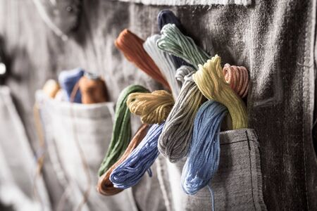Closeup of colored threads in vintage mat tailor