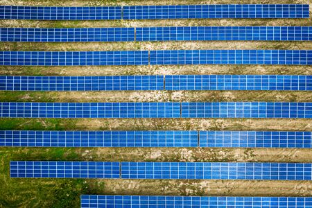 Amazing view of solar panels on dry field, aerial viewの写真素材