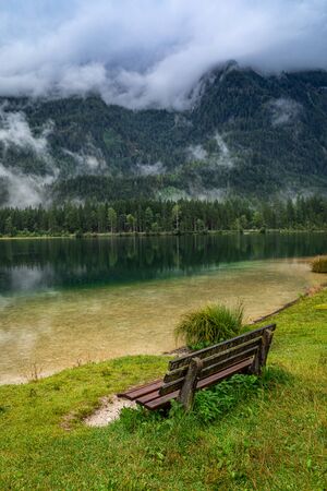 Bench by mountain lake Hintersee in Berchtesgaden national park, Deutschlandの写真素材