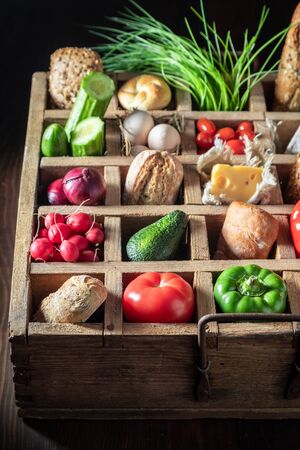 Ingredients for sandwich with fresh vegetables in wooden boxの写真素材