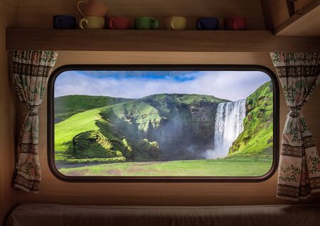 Spectacular Skogafoss waterfall in Iceland, view from camper window