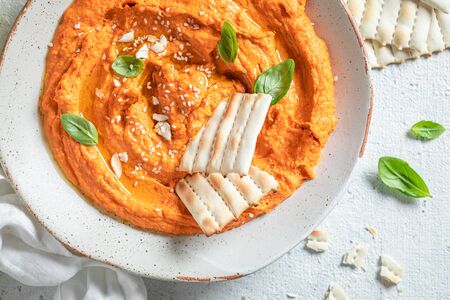 Fresh tomato hummus as quick and tasty snackの写真素材