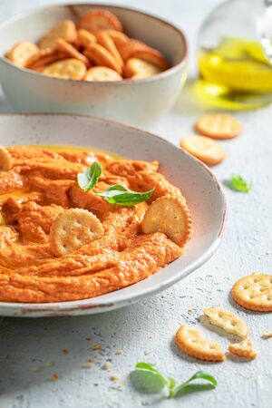 Fresh tomato hummus as healthy and quick snackの写真素材