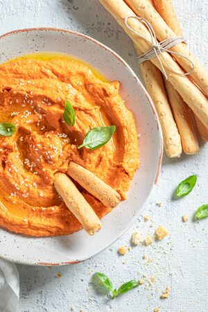 Delicious tomato hummus as quick and tasty snackの写真素材