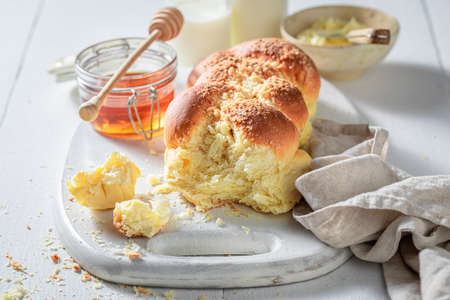 Healthy challah with honey and milk in the morningの写真素材