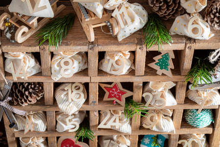 Lovely Advent Calendar for Christmas made of bags and stringon dark backgroundの写真素材