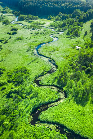 Stunning river and green swamps in summer, aerial view, Polandの写真素材