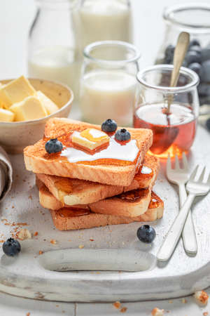 Yummy french toast as simple and sweet snack on white tableの写真素材