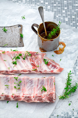 Top view of preparing ribs for grill in the summer gardenの写真素材