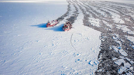 Two icebreakers on Vistula in winter, Poland, Plock, aerial view