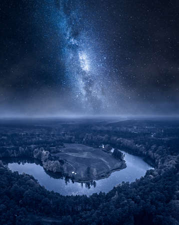 Milky way over winding river at night. Wildlife in Poland, Europeの写真素材